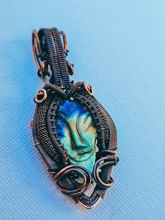 Labradorite gemstone with alien face wire wrapped in copper in heady style